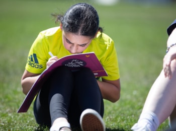 Girls on the Run participant working on a lesson during an outdoor practice.